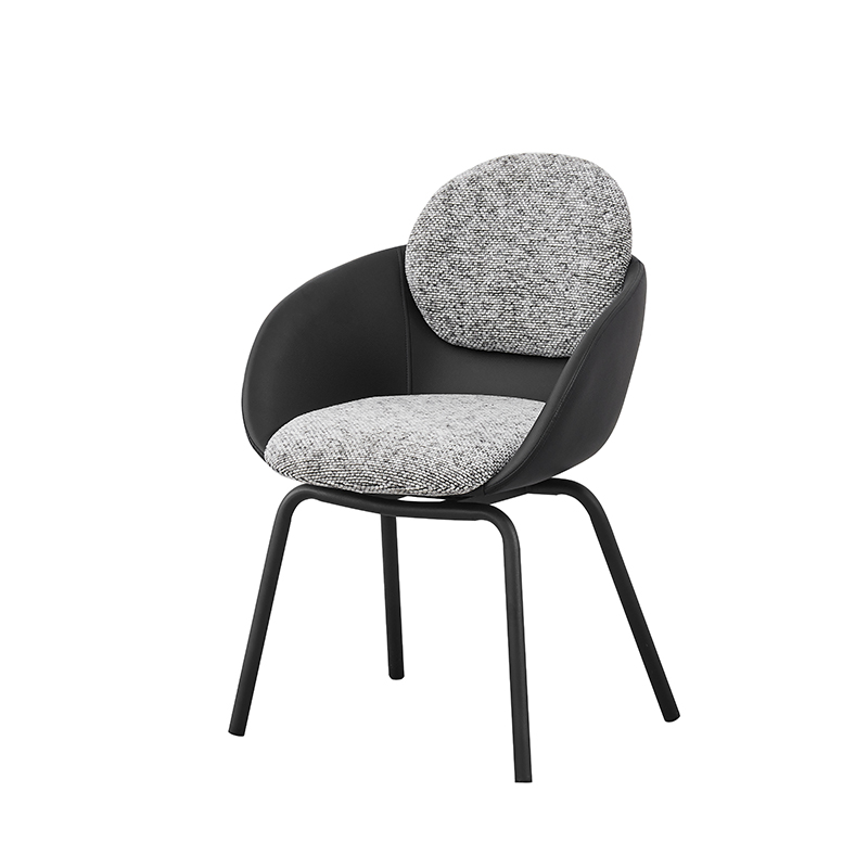 Three quarter view of black upholstered dining chair